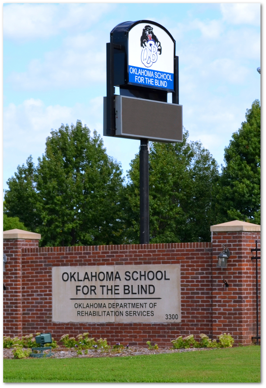 OSB School photo with sign